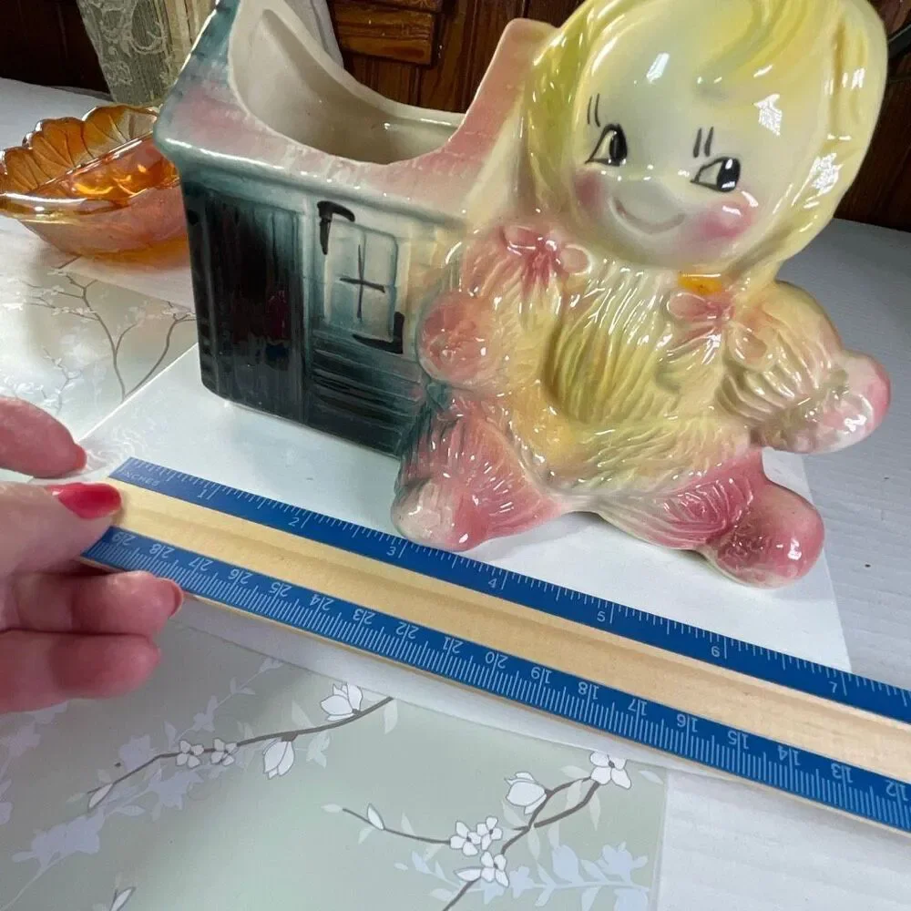 Vintage ceramic American Bisque Yarn Doll planter.